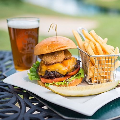 Burger beer and fries at outdoor terrace of Brookside Country Club