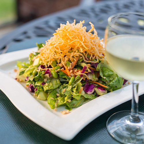 salad and wine being served on the terrace at Brookside Country Club