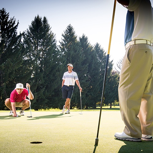 players by a golf hole at Brookside Country Club