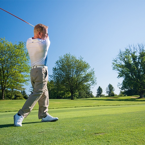 golfer swinging on the course at Brookside Country Club