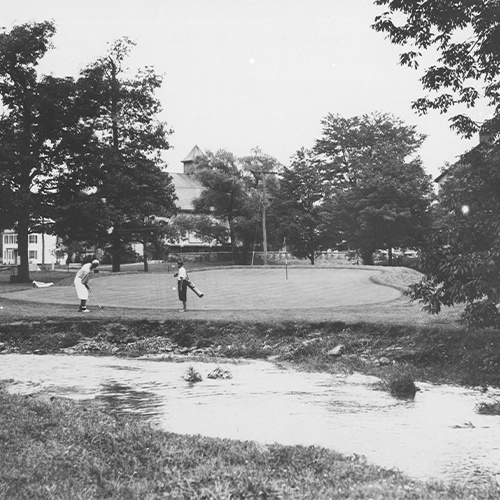 historical shot of golfers on the course
